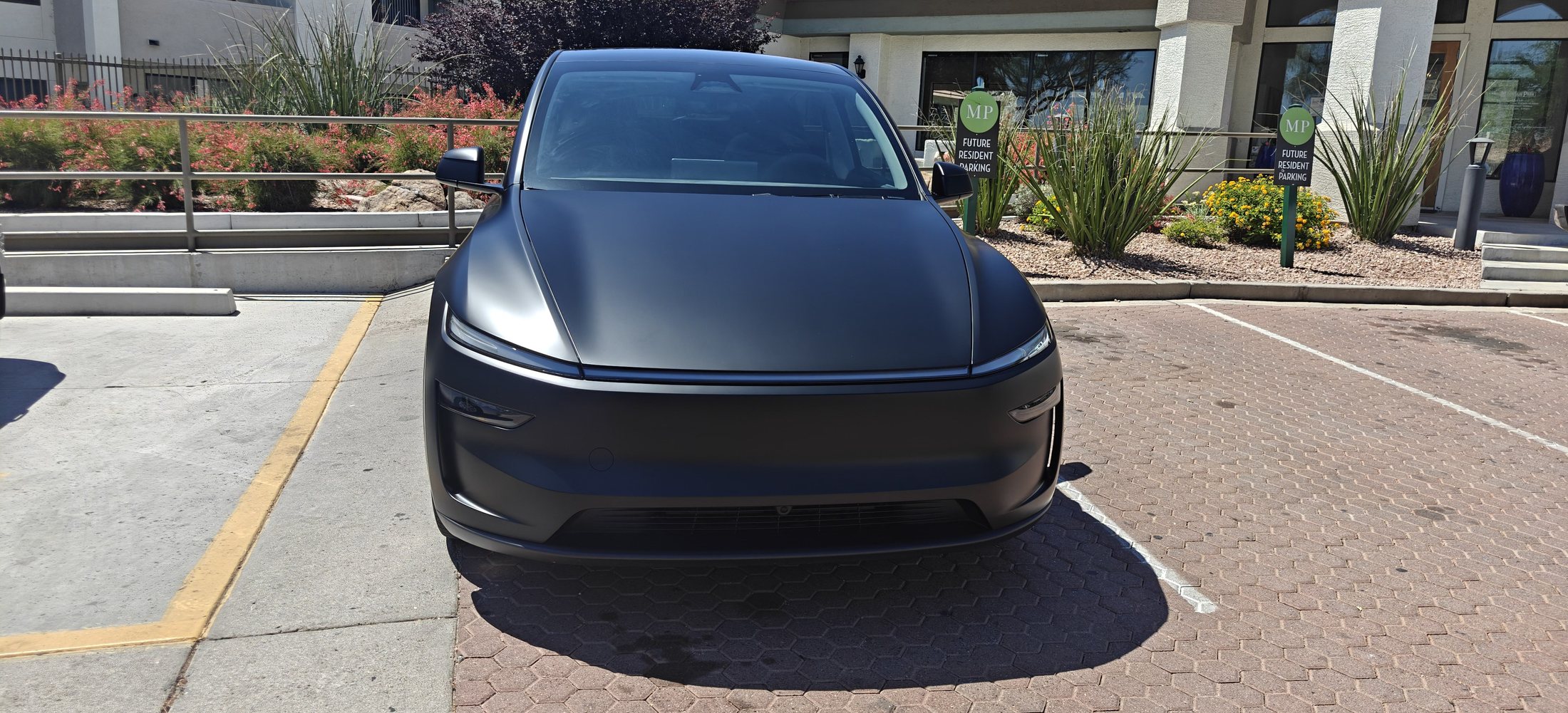 Modern front lightbar of a refreshed Tesla Model Y
